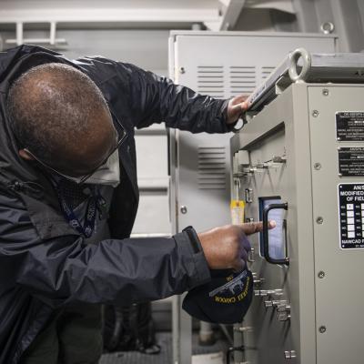 SPN-41B technician V/5 checks the screen on an AN/SPN-41B component/system aboard ITS Cavour 