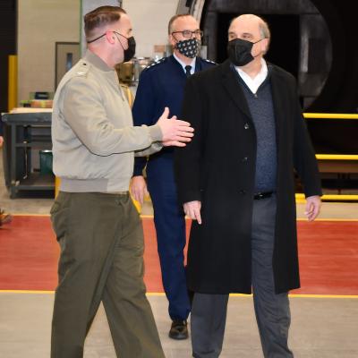 Fleet Readiness Center East (FRCE) Commanding Officer Col. Thomas A. Atkinson, left, discusses depot operations with Assistant Secretary of the Navy for Research, Development and Acquisition Frederick J. Stefany, right, and Program Executive Officer for the F-35 Lightning II Joint Program Office Lt. Gen. Erick Fick. 