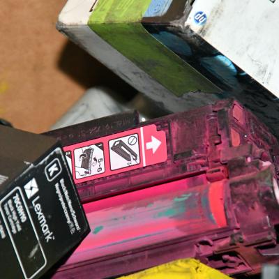 Printer cartridges await recycling after being separated in a bin at Fleet Readiness Center East (FRCE). Aggressive recycling policies at the depot aided the FRCE in increasing its landfill diversion rate to 61% in 2021. This means that 61% of the solid waste generated at FRCE was put toward renewable resources, including recycling. 