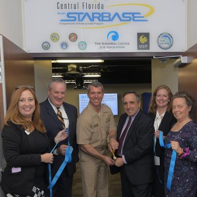 Ribbon Cutting under Central Florida STARBASE sign