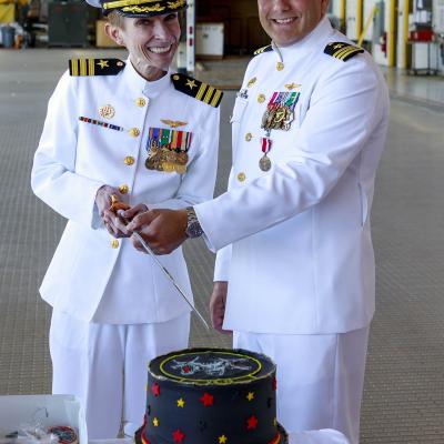 Cmdr. Colette Lazenka and Cmdr. Jason Saglimbene pose for a photo after a May 12 change of command ceremony in which Lazenka relieved Saglimbene of command of Air Test and Evaluation Squadron (VX) 30 in Point Mugu, California. (U.S. Navy photo by Rob Grabendike)
