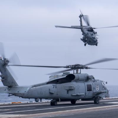 MH-60R on runway and taking off from USS Nimitz May 2022