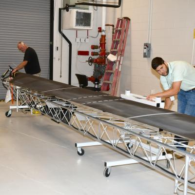 Workers set up blade balancing system