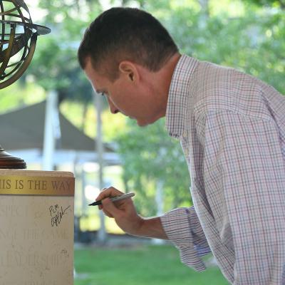  Eric Pfefferkorn signs This is the Way pedestal