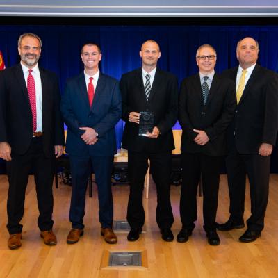 Three FRCE test equipment engineers accept a  2022 Dr. Delores M. Etter Top Scientists and Engineers of the Year award from Assistant Secretary of the Navy for Research, Development and Acquisition leadership.