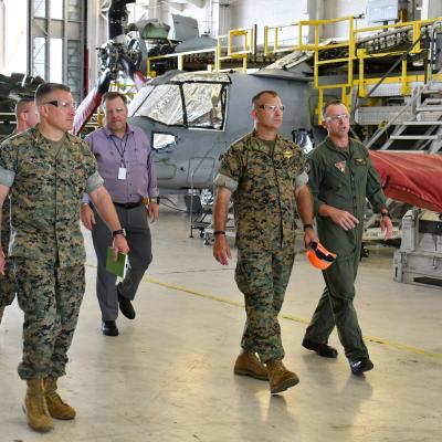 Fleet Readiness Center East (FRCE) Executive Officer Lt. Col. Jason Raper (right) discusses MV-22 overhaul operations with Maj. Gen. Scott F. Benedict, commanding general of 2nd Marine Aircraft Wing (MAW), during an Aug. 30 tour of the depot by 2nd MAW leadership.