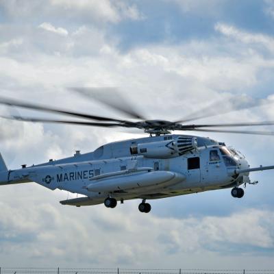 Maj. Brittany Fayos, Military Aircraft Production Deputy Director and CH/MH-53 pilot at Fleet Readiness Center East (FRCE), flies a recently overhauled CH-53 Sea Stallion helicopter for delivery to the Fleet. 