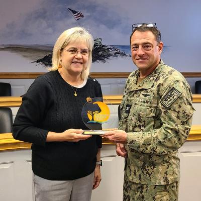 Fleet Readiness Center East (FRCE) Commanding Officer Capt. James M. Belmont (right) and FRCE Compliance and Quality Department Head Amy Morgan display the P2 Award for pollution prevention. FRCE received the award during the North Carolina Department of Environmental Quality’s Environmental Stewardship Initiative Conference, held October 24-25 in Raleigh. FRCE earned the honor in recognition of a successful industrial wastewater reduction and water conservation initiative that took place at the depot. 