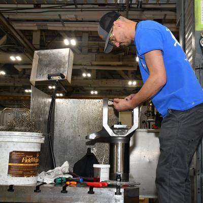 Joshua Morris, a machinist apprentice at Fleet Readiness Center East’s Repair Machine Shop, measures spindle assembly bushings. The Repair Machine Shop recently wrapped up a successful process improvement project which reduced the turnaround time for parts and components coming out of the shop and enhanced the depot’s ability to deliver parts, components, and aircraft to the warfighter. 