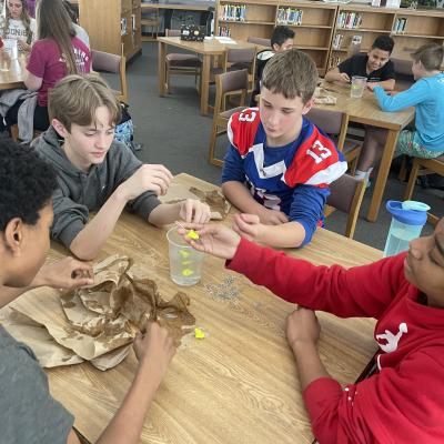 Students at Tucker Creek Middle School take part in an engineering design challenge during a visit by engineers from Fleet Readiness Center East (FRCE). The visit was part of the depot’s National Engineers Week outreach efforts, which saw FRCE engineers visiting four elementary schools, 18 middle schools and four high schools in Eastern North Carolina and engaging with more than 2,700 area students. 