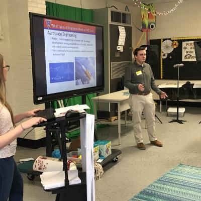 Engineers from Fleet Readiness Center East (FRCE) speak with students at Pamlico Middle School. The presentation was part of the depot’s National Engineers Week outreach efforts, which saw FRCE engineers visiting four elementary schools, 18 middle schools and four high schools in Eastern North Carolina and engaging with more than 2,700 area students. 