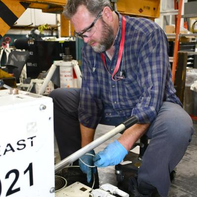 Ground support mechanic repairs equipment