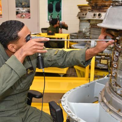 U.S. Marine Corps Sgt. Eric Andrekopoulos, assigned to Marine Attack Squadron (VMA) 223, participates in a practical exercise as part of the F402 Engine Tier 5 Remote Visual Inspection (RVI) Inspector Rating certification course at Fleet Readiness Center East, Mar. 6, 2023.