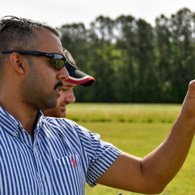 Chris Rivera, an engineer at Fleet Readiness Center East (FRCE), measures wind speed during the 2023 Ultimate Unmanned Aerial Vehicle Competition held April 22 in Newport. Students representing eastern North Carolina high schools designed unmanned aerial vehicles for the competition, which evaluated the speed and maneuverability of their creations.