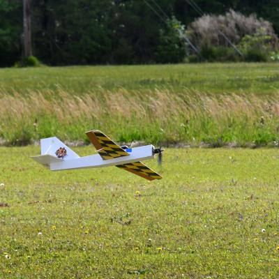 An unmanned aerial vehicle (UAV) heads in for a landing during the 2023 Ultimate Unmanned Aerial Vehicle Competition held April 22, in Newport. Students representing eastern North Carolina high schools designed unmanned aerial vehicles for the competition, which evaluated the speed and maneuverability of their creations. Engineers from Fleet Readiness Center East (FRCE) coached and assisted each team throughout the process.