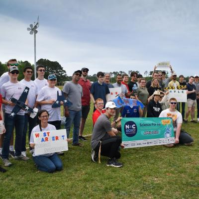 Participants in the 2023 Ultimate Unmanned Aerial Vehicle Competition, held April 22 in Newport, pose for a group photo. Students representing eastern North Carolina high schools designed UAVs for the competition, which evaluated the speed and maneuverability of their creations. 