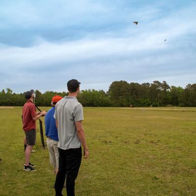 Engineers from Fleet Readiness Center East (FRCE) pilot unmanned aerial vehicles (UAVs) during the 2023 Ultimate Unmanned Aerial Vehicle Competition, held April 22 in Newport. Students representing eastern North Carolina high schools designed UAVs for the competition, which evaluated the speed and maneuverability of their creations. 