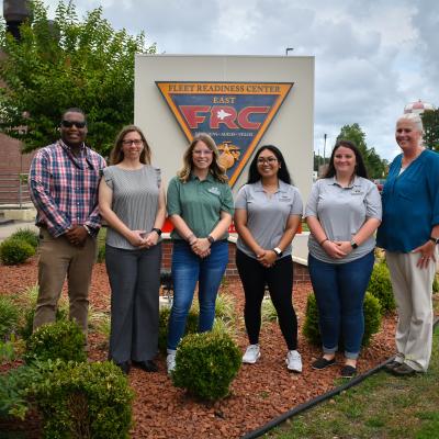 Members of Fleet Readiness Center East’s (FRCE) Fleet Support Team’s Advanced Technology and Innovation (ATI) Team pose for a group photograph with local educators during an externship program FRCE hosted aimed at showcasing career opportunities to area students. 