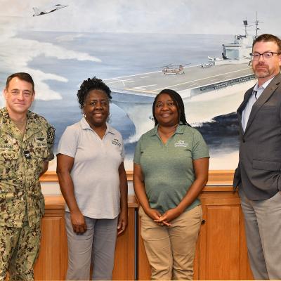 leet Readiness Center East (FRCE) leaders pose for a group photograph with local educators during an externship program FRCE hosted aimed at showcasing career opportunities to area students. 