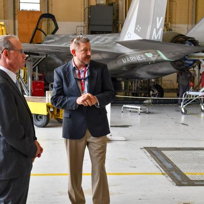 Fleet Readiness Center East (FRCE) F-35 Branch Head Ike Rettenmair, right, and U.S. Rep. Greg Murphy discuss FRCE's support of the F-35B Lightning II during Murphy’s visit to the facility Aug. 14. 
