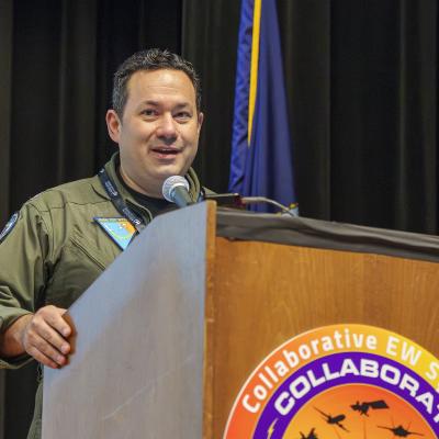 Capt. David Halpern, commodore, Naval Test Wing Pacific, delivers opening remarks during the Collaborative EW Symposium on March 12 in Point Mugu, California. (U.S. Navy photo by Rob Grabendike)