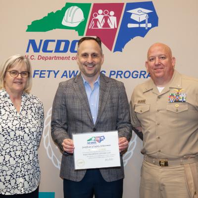 Fleet Readiness Center East Executive Officer and Compliance and Quality Department Head pose for group photo with North Carolina Labor Commissioner