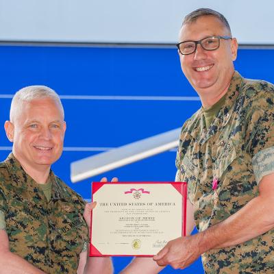 Brig. Gen. David Walsh presents Colonel Brian Taylor with the Legion of Merit