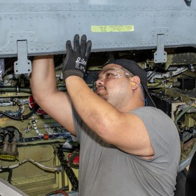 Man performing maintenance on aircraft