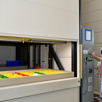 Man stands in front of machine 