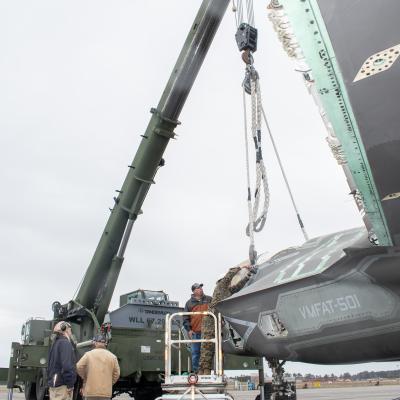 Marines use crane to lift decommissioned F-35 airframe