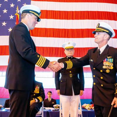 Two sailors shaking hands