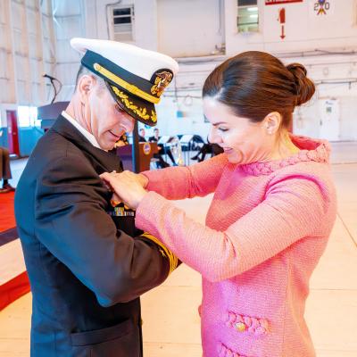 Sailor and woman standing together