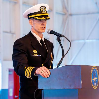 Sailor speaking at a podium