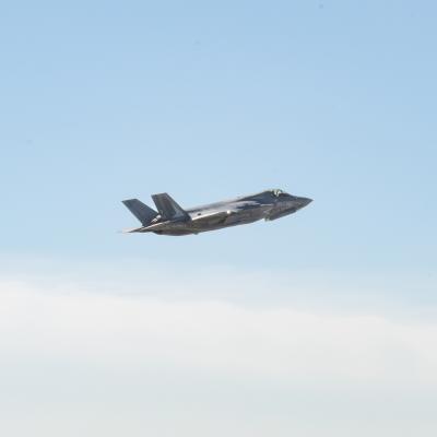 Long shot of F-35B Lightning II aircraft against blue sky background