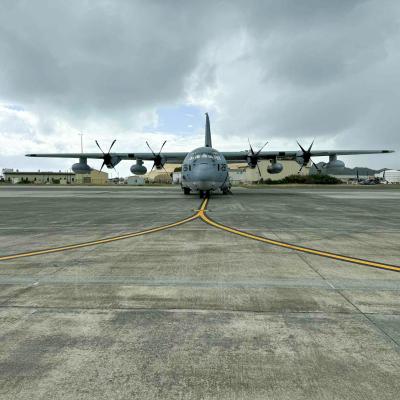 Front of a grey C-130 aircraft 