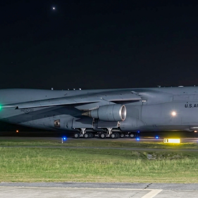 Air Force C-5 aircraft on tarmac at night 