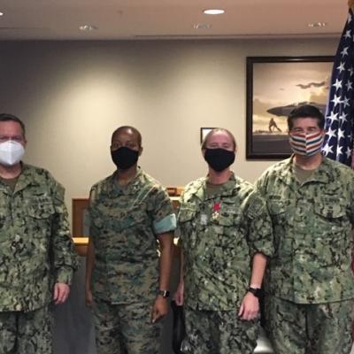 Rear Adm. Shane Gahagan, Marine Corps Col. Tamara Campbell, Capt. Laura Schuessler, Vice Adm. Mike Moran