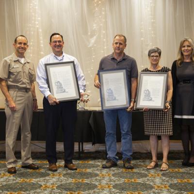 Winners of the Dr. L.T.E. Thompson Memorial Award accept their certificates from Rear Adm. Scott Dillon, NAWCWD commander, and Joan Johnson, NAWCWD executive director, during the 2019 Honorary Awards Ceremony at China Lake on June 25. (U.S. Navy photo by Ryan Smith)