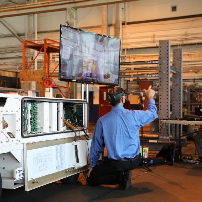 Navy engineers demonstrate the Augmented Reality Remote Maintenance Support Service during a recent technology exercise
