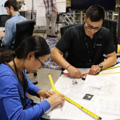Diane Phung and Jesus Ramos assemble home-made Yagi antennas during a two-day “Fox Hunt” class 