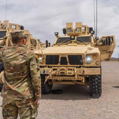 Photo of soldier and MRAP
