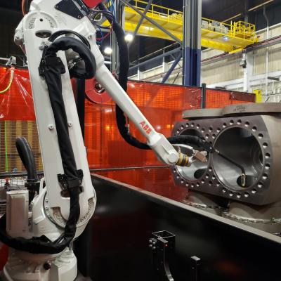 Robotic welding arm inside the body of the Improved Low Loss Launch Valve 