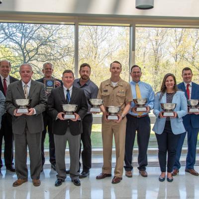 Deputy Commander Thomas Rudowsky with award-winners of the NAVAIR 2022 Commander’s Awards, Wednesday, April 20.   
