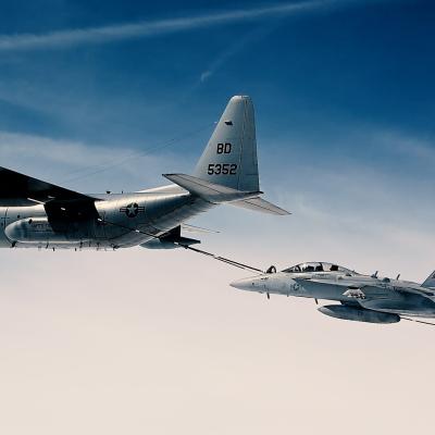 A KC-130T refuels an EA-18G Growler in the skies over Naval Air Station Patuxent River, Maryland.