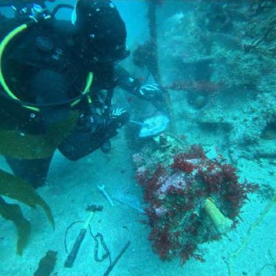 U.S. Navy Seabee Divers from Underwater Construction Team (UCT) 2’s Construction Dive Detachment (CDD) Charlie 80 feet under water