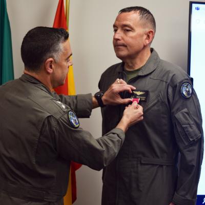 Rear Adm. John Lemmon presents a Legion of Merit award to Col. Mark Amspacher
