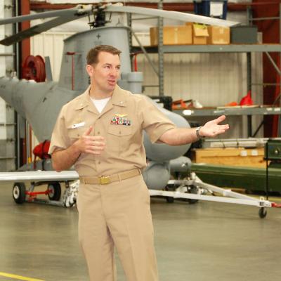 Outgoing Cmdr. Matthew Densing gives remarks during UX-24's Change of Command ceremony.