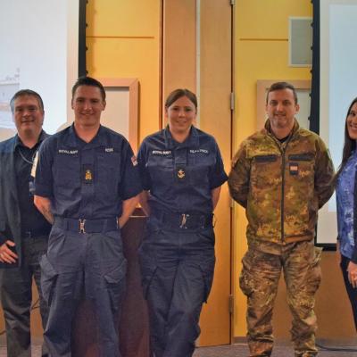 Three international sailors completing NAWCAD WOLF AN/SPN-41B technical training