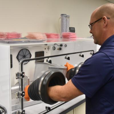 Mechanical engineer Michael Ruff using a piece of equipment