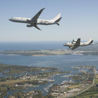 A P-8A and a P-3C Orion fly over Patuxent River, Md. 